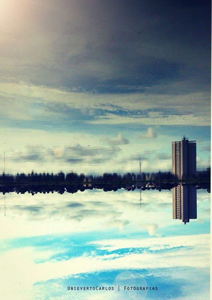 sky, cloud - sky, built structure, architecture, building exterior, city, reflection, cloud, cloudy, nature, tranquility, outdoors, weather, day, scenics, water, tranquil scene, no people, beauty in nature, lake