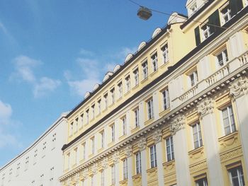 Low angle view of building against blue sky