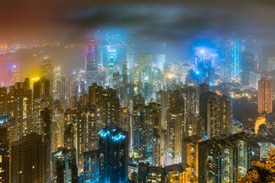 Illuminated modern buildings in city at night