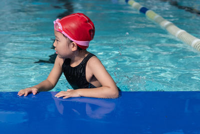 Girl looking away in swimming pool