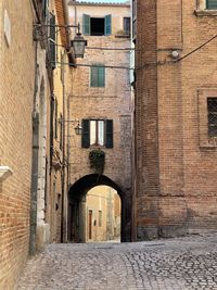 Alley amidst buildings in city