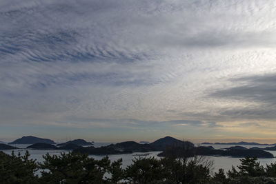 Scenic view of mountains against sky at sunset