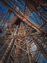 Eiffel tower architecture details paris, france. underneath the metallic structure, steel elements 