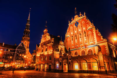 Low angle view of illuminated temple against sky at night