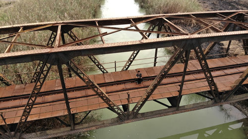 Abandoned metallic bridge over water