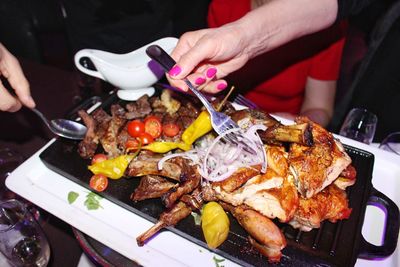 High angle view of person preparing food on table
