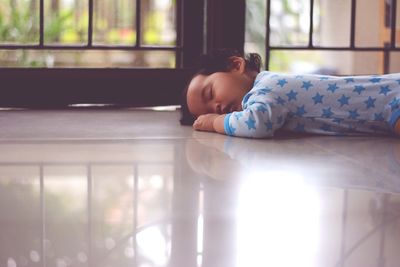 Funny baby sleeping on the floor