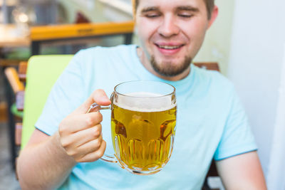 Portrait of a man drinking glass