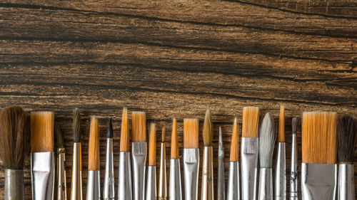 Close-up of clothes hanging on wood