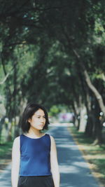 Young woman on road in park