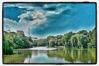 Scenic view of lake against cloudy sky