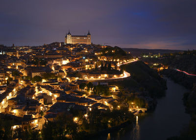 High angle view of illuminated buildings in city at night