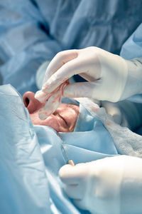 Midsection of doctor examining patient leg