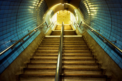 Low angle view of steps leading towards tunnel