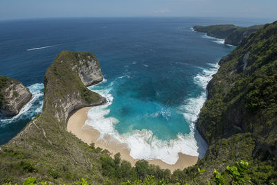 High angle view of rocks in sea against sky