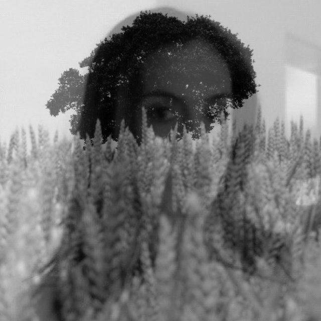 CLOSE-UP PORTRAIT OF YOUNG WOMAN WITH PINE TREE DURING WINTER