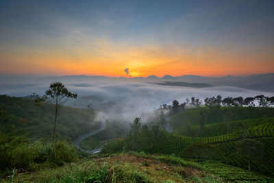 Scenic view of landscape against sky during sunset