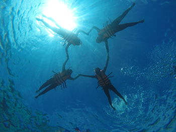 People swimming in sea