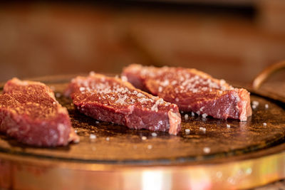 Close-up of meat in plate on table