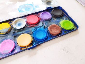 High angle view of various containers on table