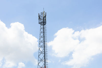 Low angle view of communications tower against sky