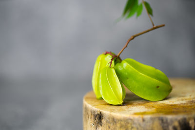 Close-up of green leaf on table