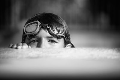 Portrait of girl swimming in pool during sunny day