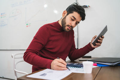 Young business man working in office