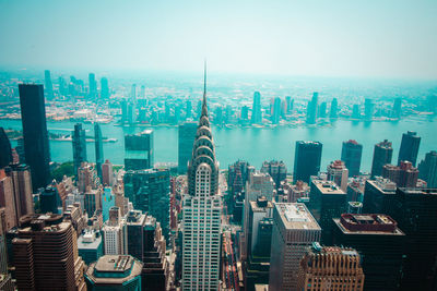 Modern buildings in city against clear sky