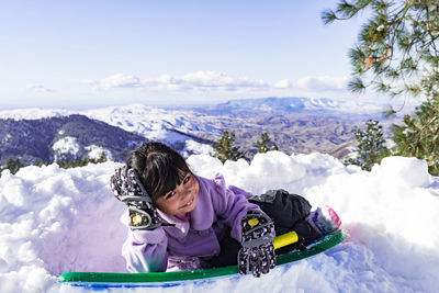 Woman in snow covered mountains