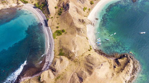 Aerial view of mountains by sea