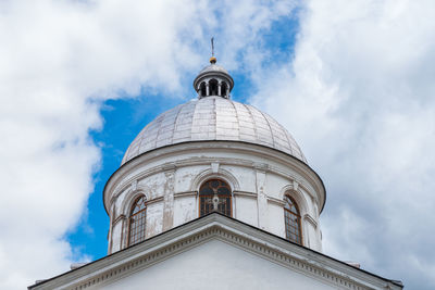 Former brick greek catholic church in werchrata, erected in 1910. the dramatic sky in the background