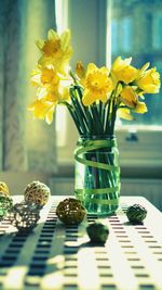 Close-up of sunflowers in vase on table