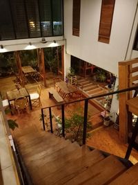 Empty chairs and tables in building