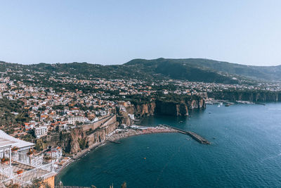 High angle view of townscape by sea