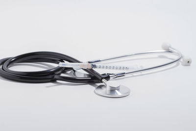 Close-up of eyeglasses on table against white background