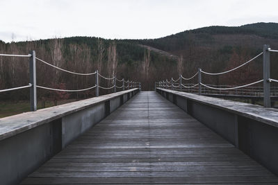 Footbridge against sky