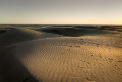 Scenic view of desert against clear sky