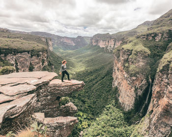 Rear view of man walking on mountain