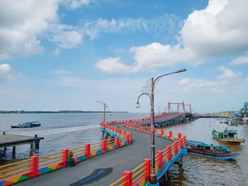 Pier over sea against sky