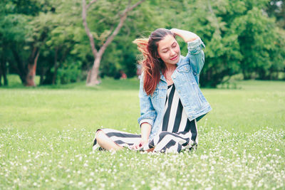 Young woman wearing hat on field