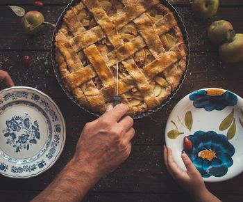 Midsection of person preparing cake