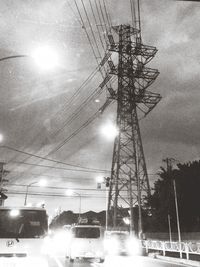 Low angle view of electricity pylon against sky