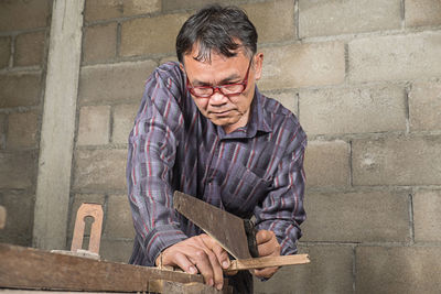 Carpenter working in carpentry workshop