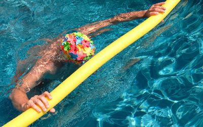 High angle view of man swimming in pool