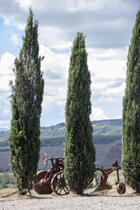 Bicycles parked on land against sky