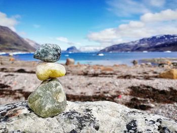 Rocks on beach against sky