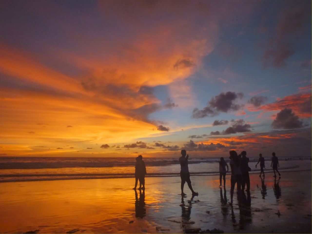 sunset, sea, water, beach, horizon over water, silhouette, orange color, sky, lifestyles, leisure activity, shore, men, togetherness, scenics, beauty in nature, vacations, person, nature, tranquil scene