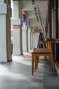 Empty chairs and tables in building