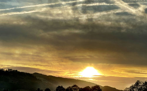 Scenic view of dramatic sky during sunset